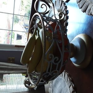 Wrought iron pedestal fruit bowl 10" inches tall X 12" inches wide.